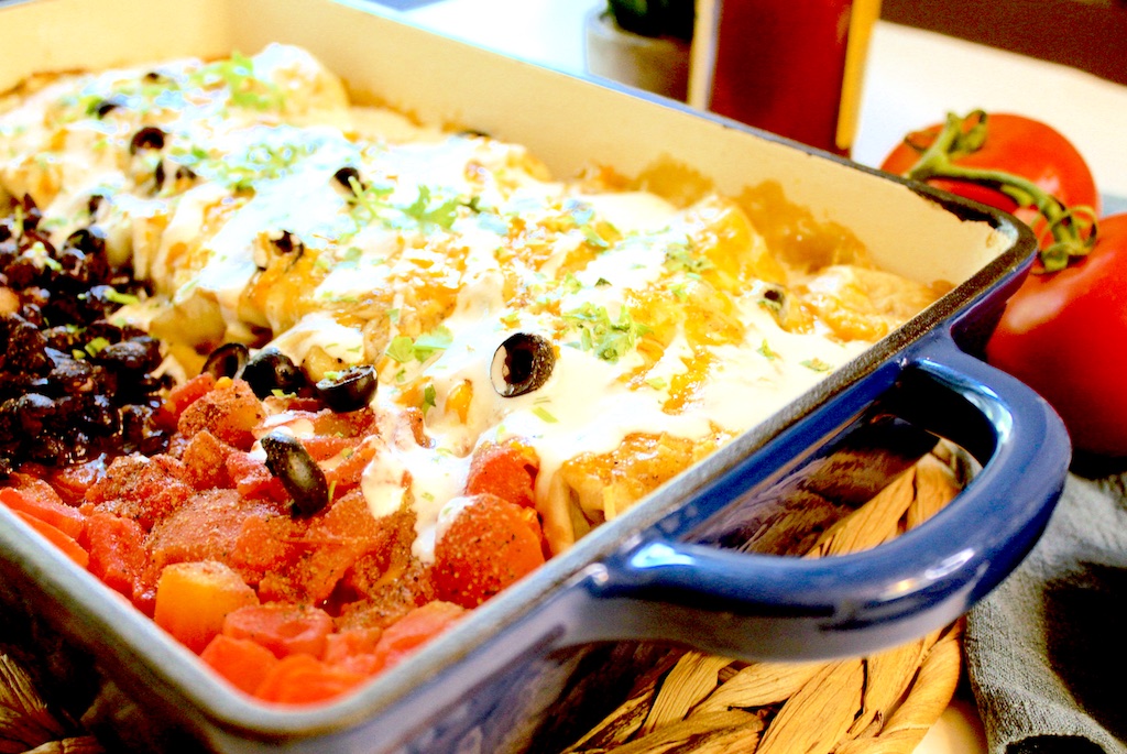 Black beans, tomatoes and baked enchiladas. Quick, easy, delicious.