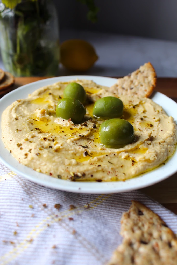 Easy Mediterranean Hummus is made with simple ingredients to get a creamy, addicting, fluffy texture, and amazing results that keep you coming back for more.