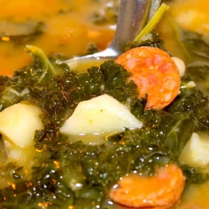 Portuguese Kale Soup or Caldo Verde is a hardy and comforting soup for any season. Packed with Portuguese sausage, potatoes, kale, and tons of flavor!