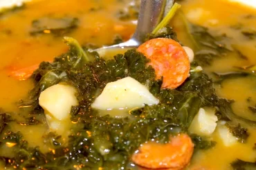 Portuguese Kale Soup or Caldo Verde is a hardy and comforting soup for any season. Packed with Portuguese sausage, potatoes, kale, and tons of flavor!