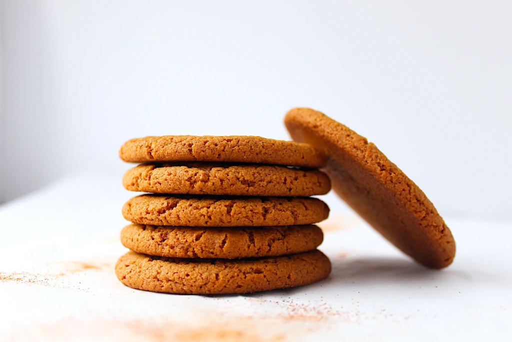 A lovely stack of molasses cookies, dusted with cinnamon and spice.